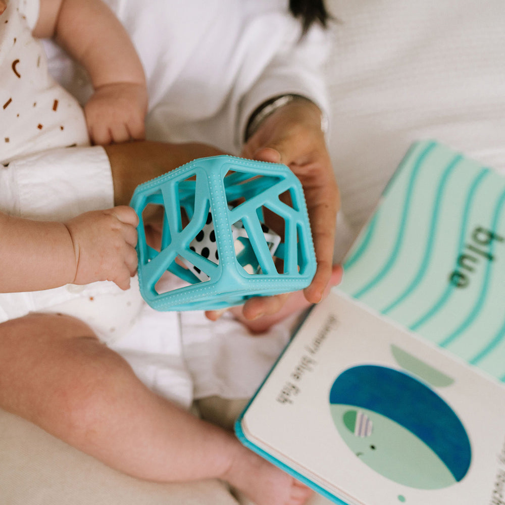 Teething cube and baby book