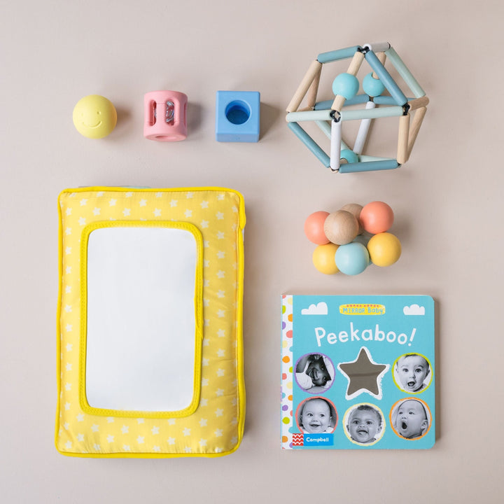 Playkit filled with developmental toys for newborns and 3-6 month old babies.