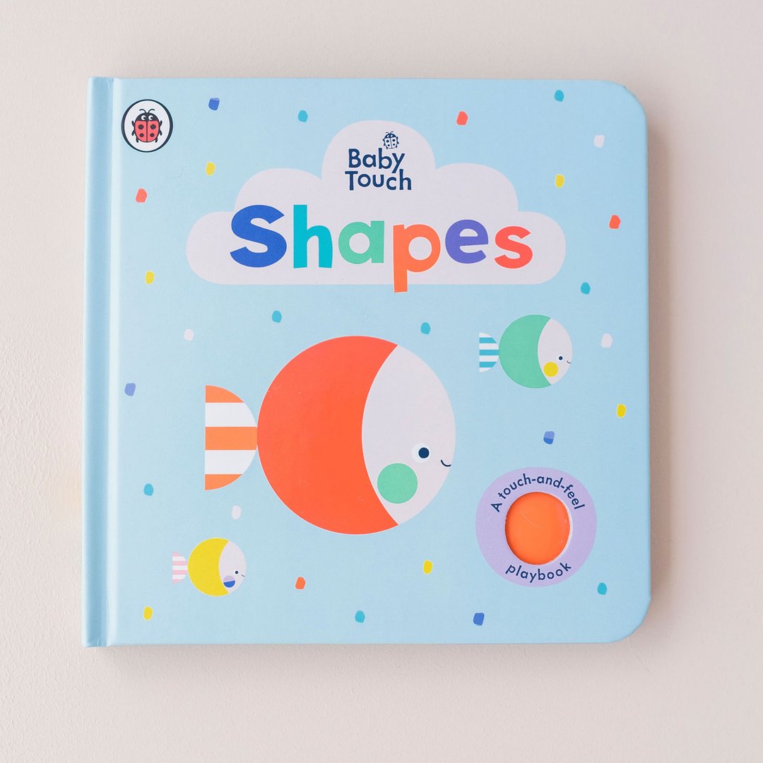 Baby Touch: Shapes book with blue cover and picture of fishes on it.